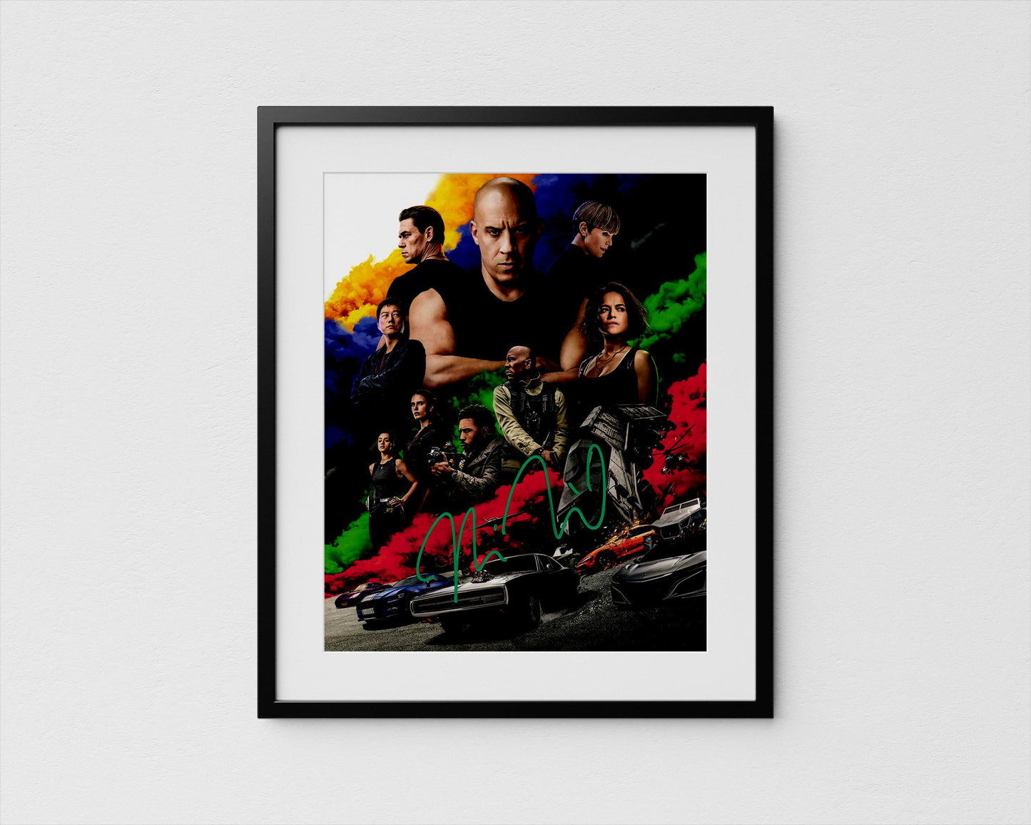 The image is a framed poster featuring a collage of various characters from a movie, including a bald man, a woman, and other individuals.