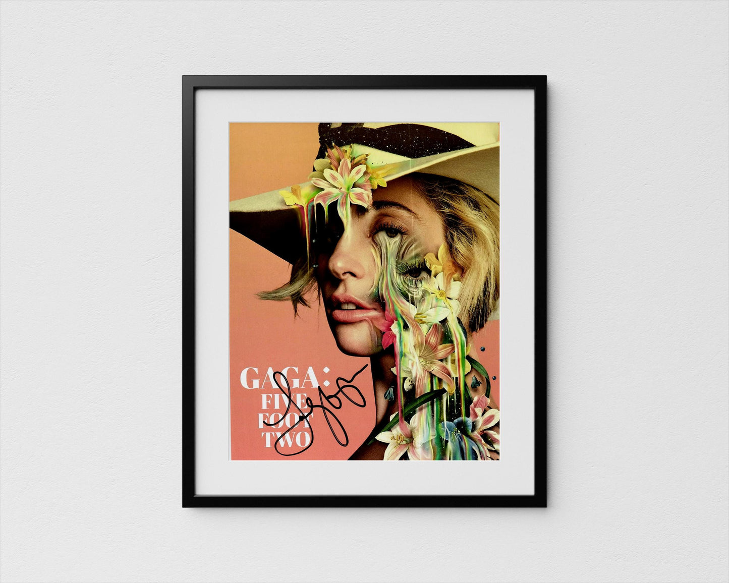 The image is a framed poster featuring a close-up portrait of a woman with a flower-adorned hat.