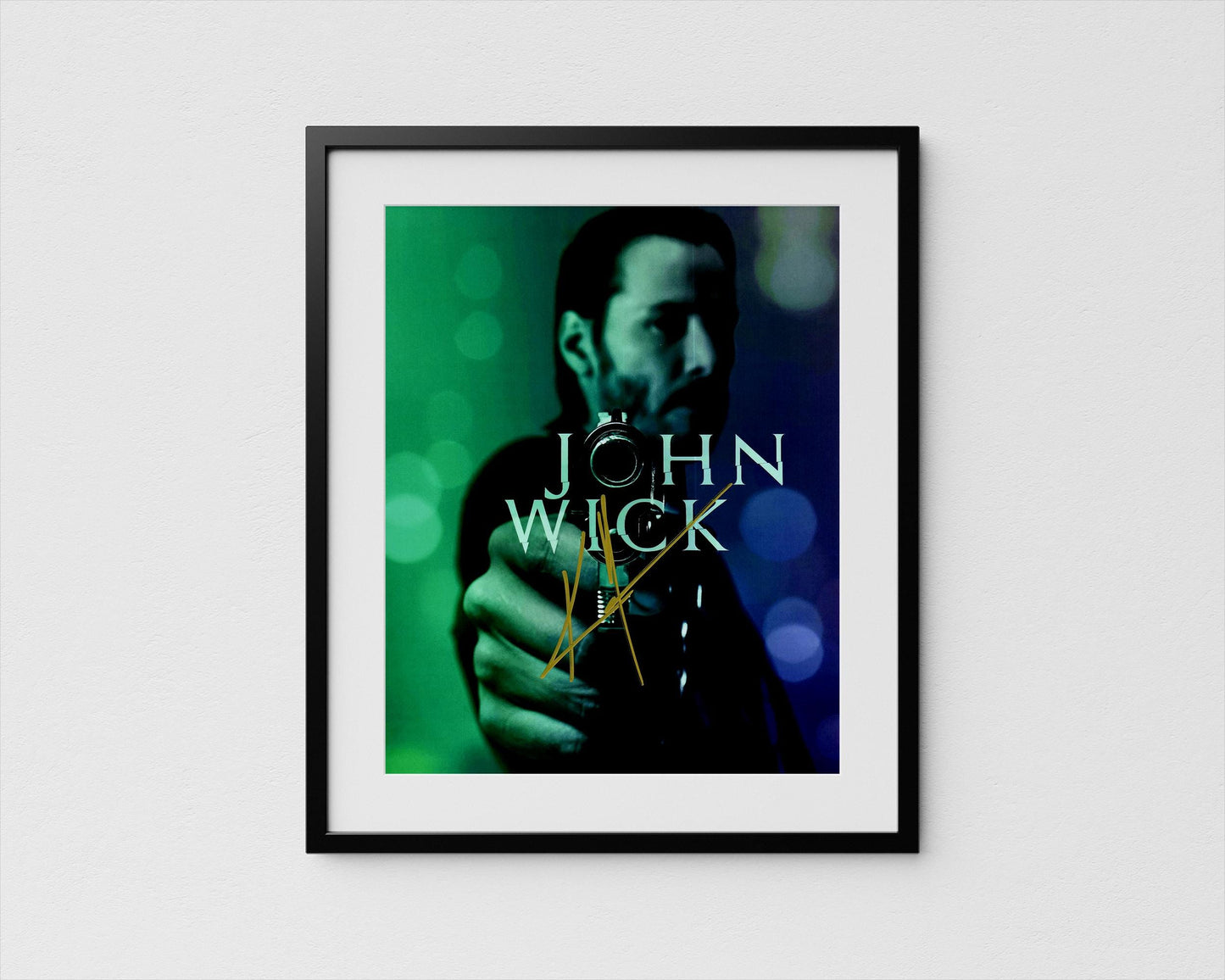 A framed poster featuring a close-up of a person's face, with the text "JOHN WICK" prominently displayed.