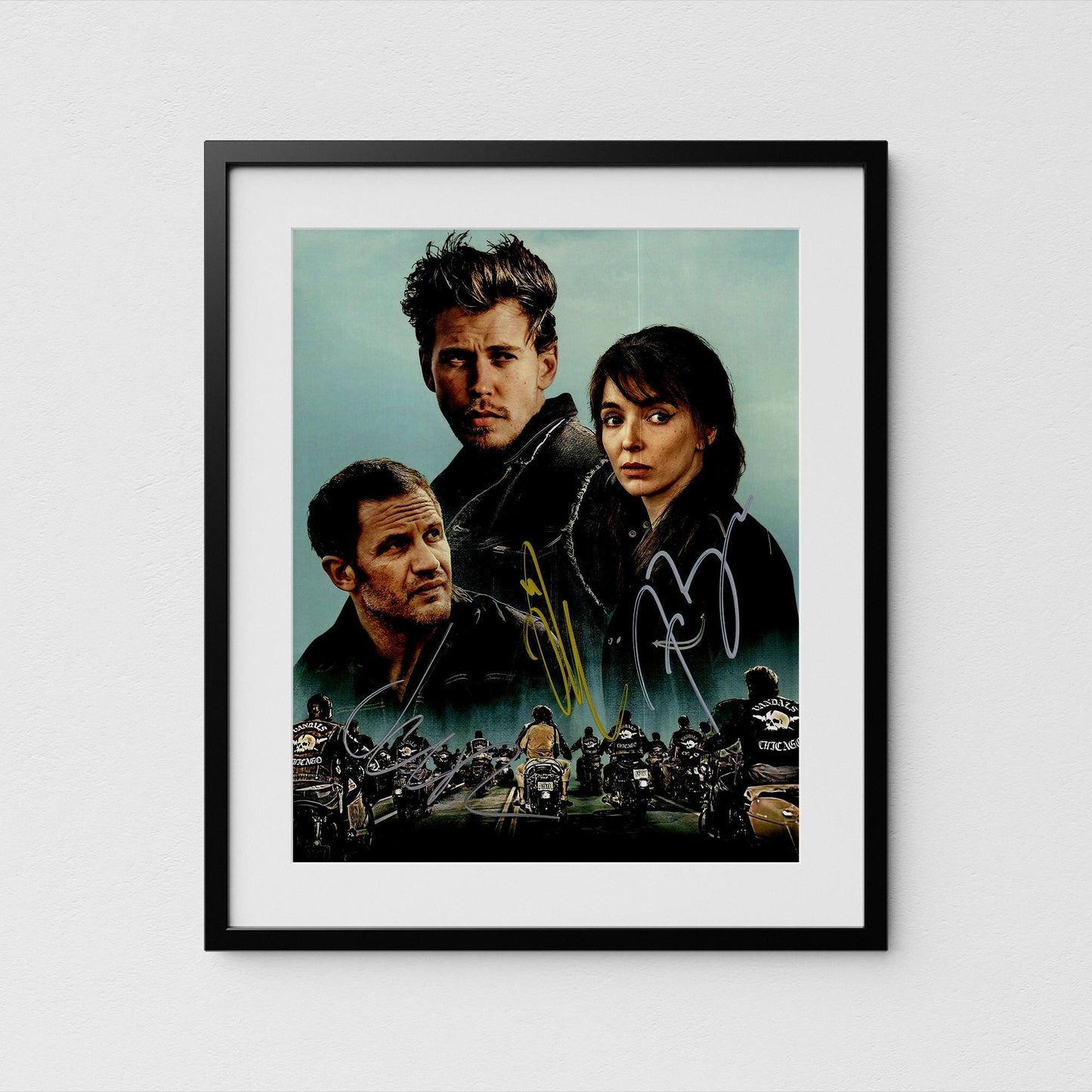 The image is a framed poster Bikeriders featuring Austin Butler. and Tom Hardy, likely with motorcycles in the background.