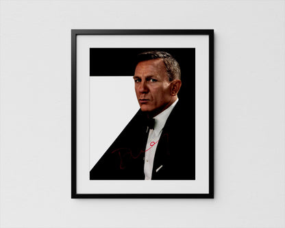 A framed portrait of a man in a suit, with a serious expression on his face.