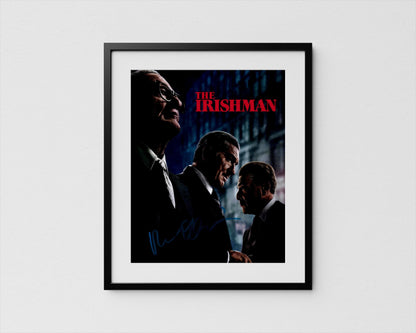 The image is a framed poster featuring three men in suits, with the title &quot;The Irishman&quot; prominently displayed.