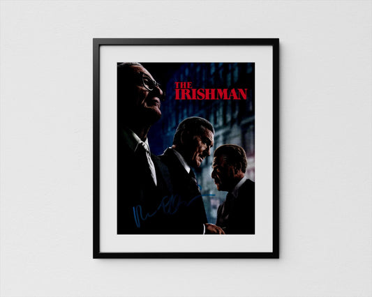 The image is a framed poster featuring three men in suits, with the title &quot;The Irishman&quot; prominently displayed.