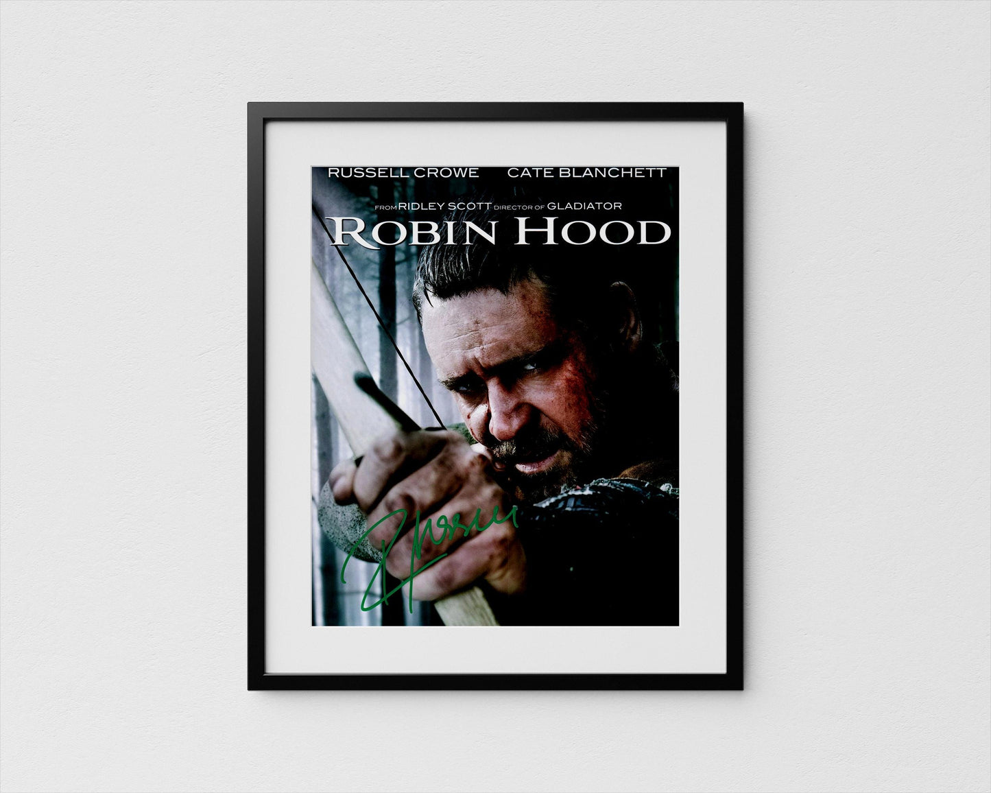 The image is a framed poster featuring a close-up of a man&#39;s face, likely from the movie Robin Hood.