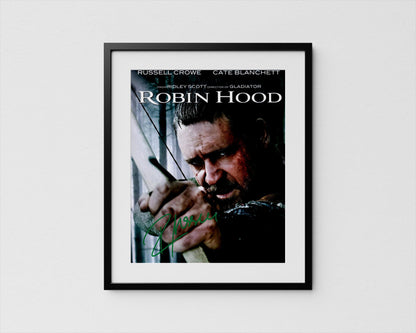 The image is a framed poster featuring a close-up of a man&#39;s face, likely from the movie Robin Hood.