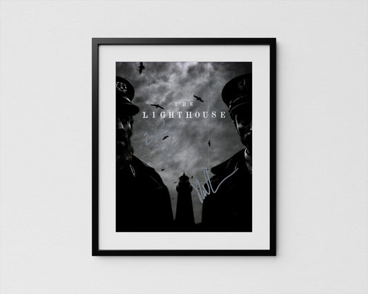 The image is a framed poster featuring two silhouetted figures, likely representing characters from a film or television show, with a lighthouse in the background.
