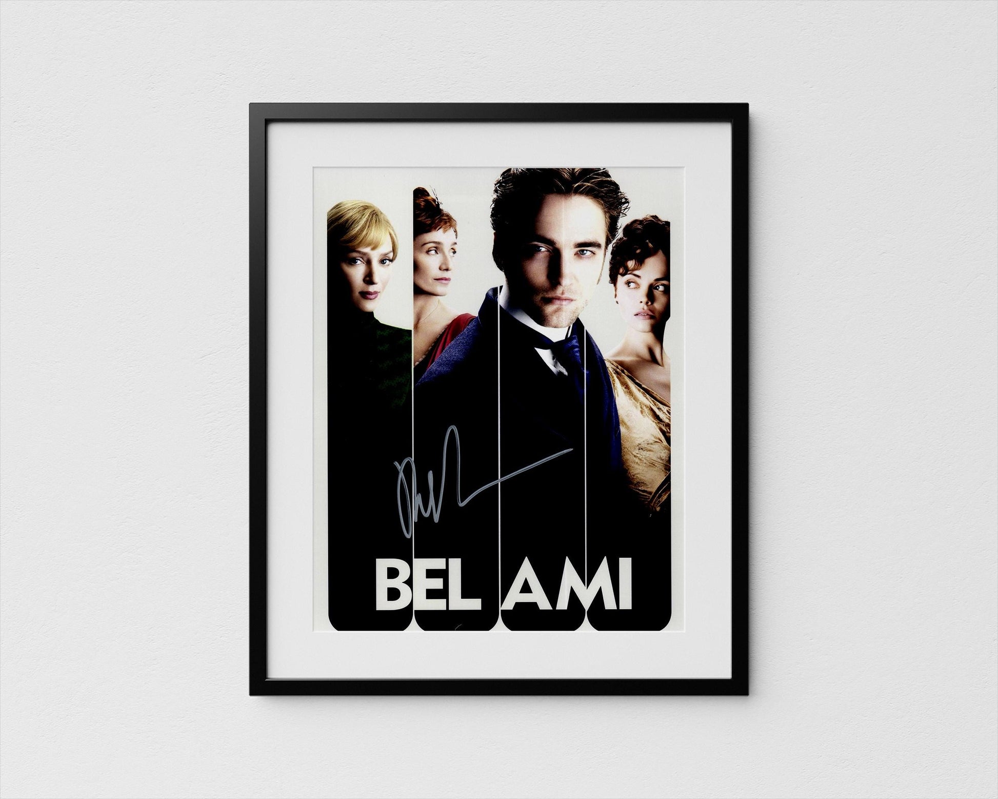 The image is a framed poster featuring portraits of four individuals, likely from the movie &quot;Belami&quot;.