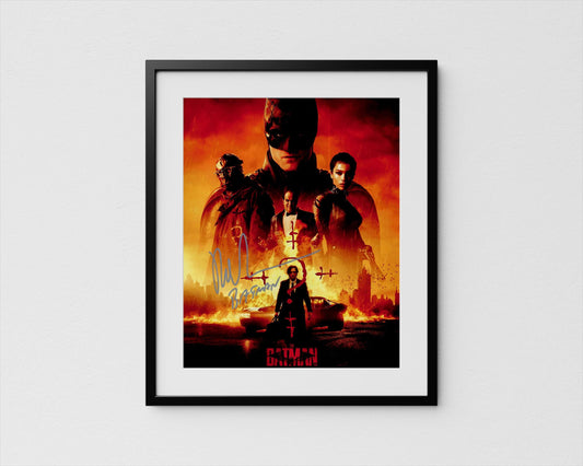 The image is a framed poster featuring the Batman logo and various characters from the Batman franchise, including the iconic superhero himself.