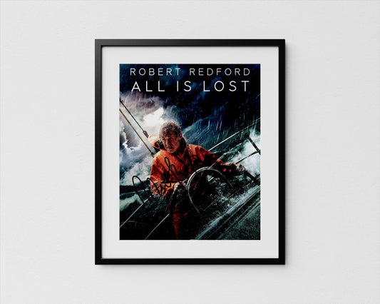 The image is a framed poster featuring a man in a red jacket, sailing on a boat in rough seas.