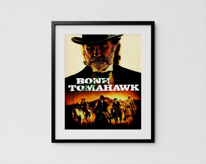 The image is a framed poster featuring a close-up of a man&#39;s face wearing a hat, with a cowboy hat and a bandana. The poster also includes a collage of other images depicting people on horseback, suggesting a western or cowboy theme.