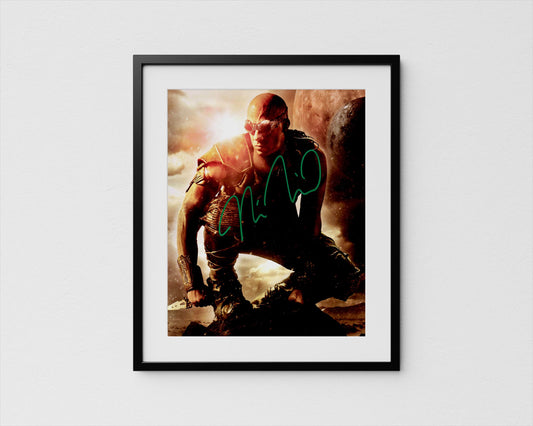 A framed image depicting a person crouching in a dramatic pose, with a fiery background.