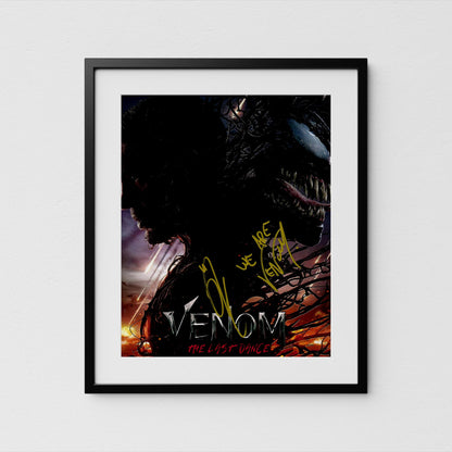 The image is a framed poster or artwork featuring a close-up of a dark, ominous creature with a large, menacing mouth, likely representing the character of the Marvel superhero, Venom.
