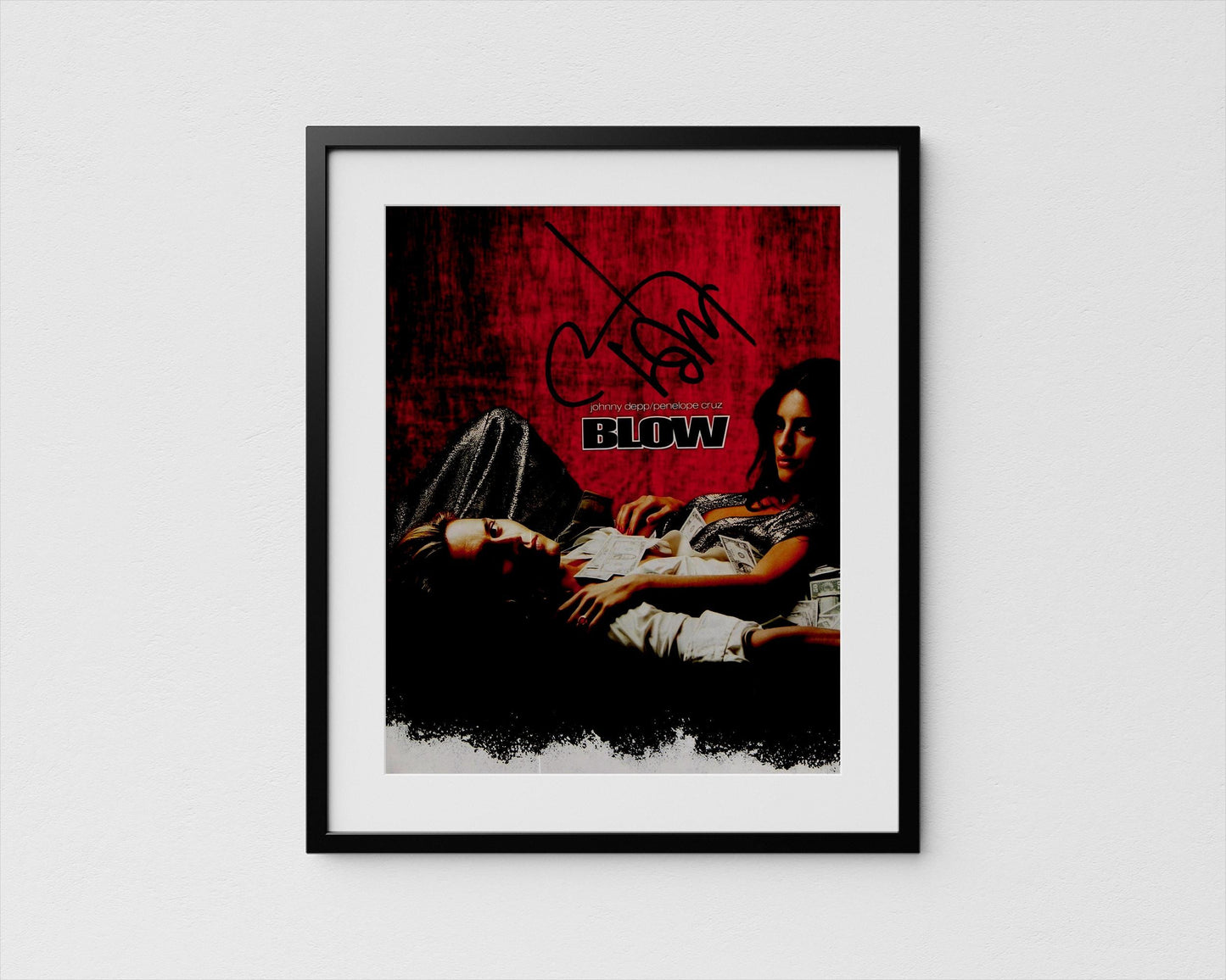 The image is a framed poster featuring a woman lying down and a man lying next to her. The poster has a red and black color scheme and includes the text &quot;BLOW&quot; prominently displayed.