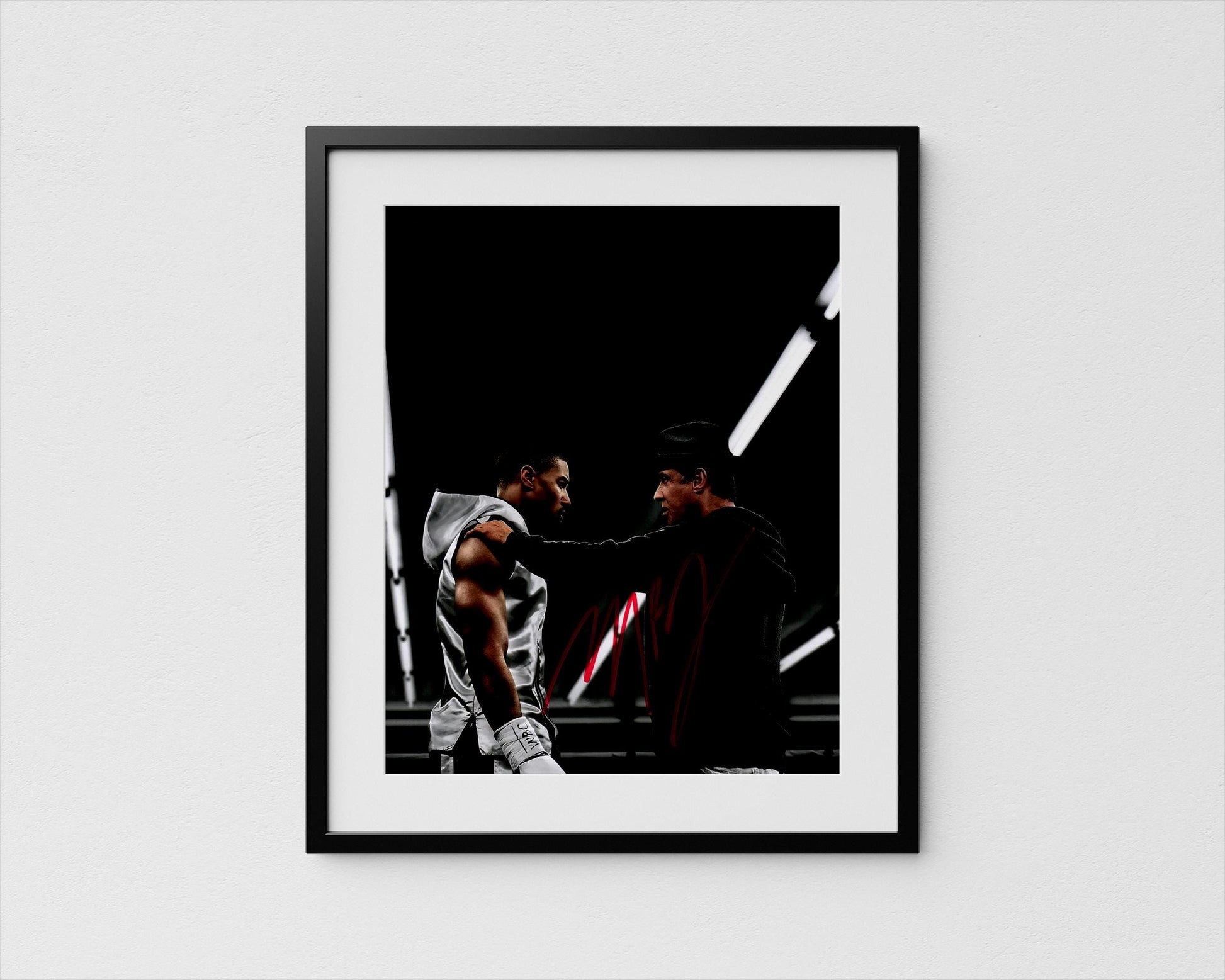 two men engaged in a conversation, with one man appearing to be in a boxing stance and the other man standing nearby.