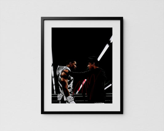 two men engaged in a conversation, with one man appearing to be in a boxing stance and the other man standing nearby.