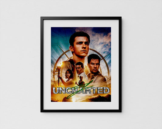 The image is a framed poster featuring the title &quot;Uncharted&quot; along with various characters from the movie.