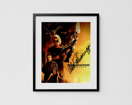 The image is a framed poster featuring a close-up of a character from the movie &quot;Terminator: The Fate&quot; with a signature in the corner.