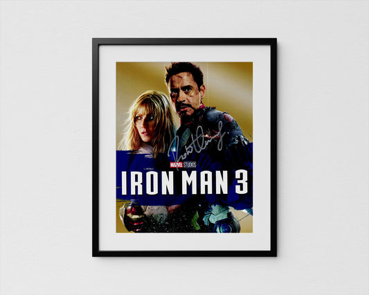 The image is a framed poster featuring two people, likely from the Marvel Cinematic Universe, posing together.