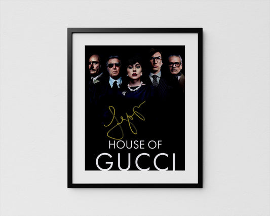The image is a framed poster featuring the cast of the movie &quot;House of Gucci&quot;.
